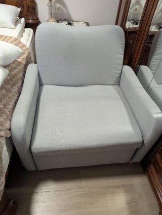 Sillón cama gris de tela