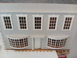 Casa de muñecas de madera