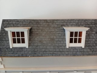 Casa de muñecas de madera