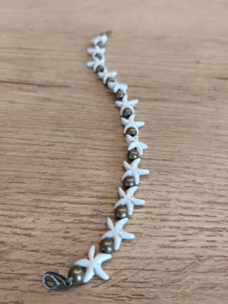 Pulsera estrellas de mar y perlas doradas