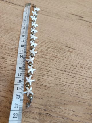 Pulsera estrellas de mar y perlas doradas