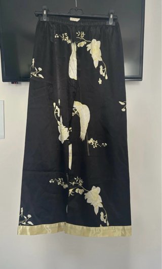 Pantaloni pigiama neri con dettagli oro