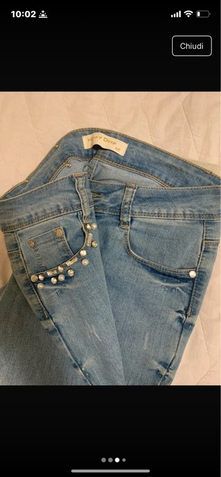 Jeans azzurro sfumato  con perle
