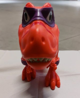 Dinosauro Giocattolo Arancione con Maschera