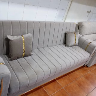Sofá cama color gris en tela
