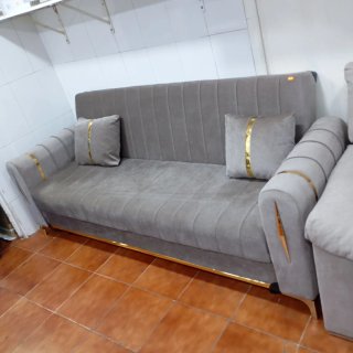 Sofá cama color gris en tela