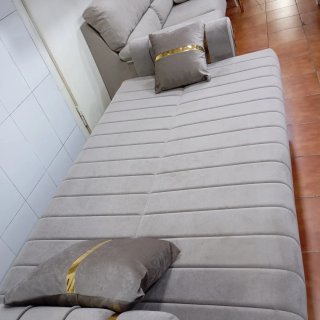 Sofá cama color gris en tela