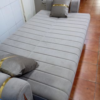 Sofá cama color gris en tela