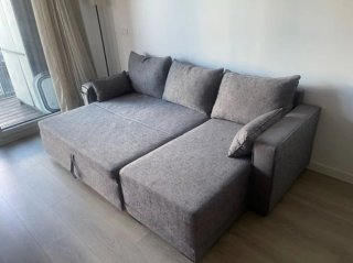 Sofá cama gris de tela