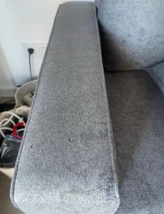Sofá cama gris de tela