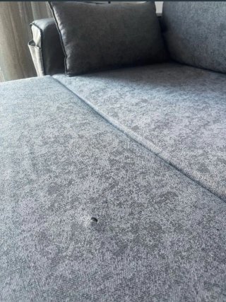 Sofá cama gris de tela