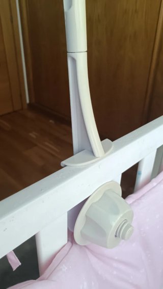 Soporte con caja de música para cuna