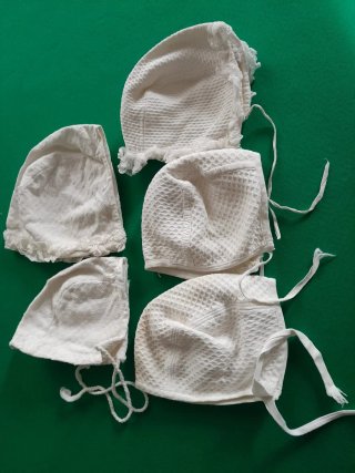 Cuffiette neonato in cotone (set da 4)