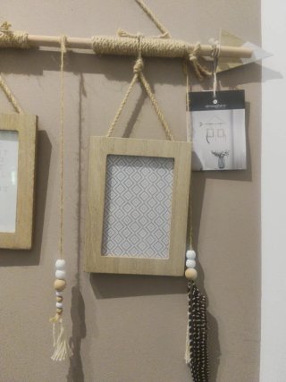 Cornice in legno con freccia e corde
