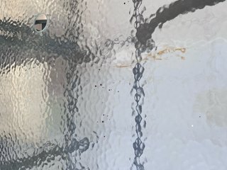 Tavolo da giardino in vetro e ferro grigio