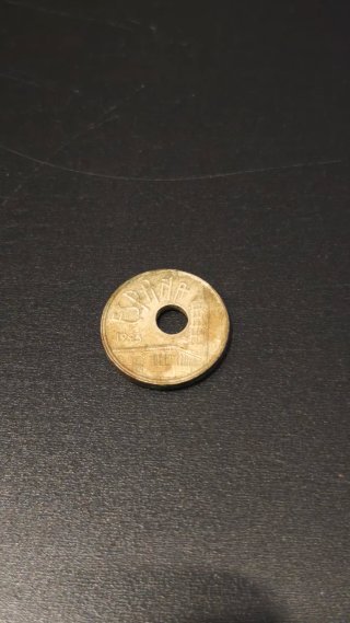 Moneda 25 Pesetas con Agujero de lado