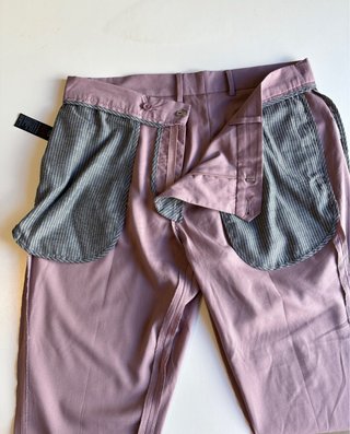 Traje rosa de tres piezas