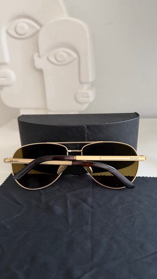 Gafas de sol Prada aviador doradas