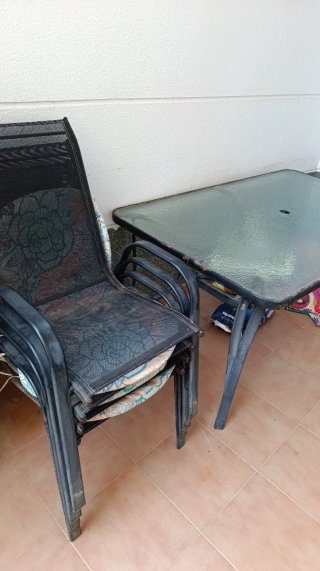 Mesa cristal y acero jardín + 4 sillas