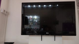 Televisión LG 38 con soporte de pared