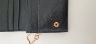 Pochette Prada nera con catena