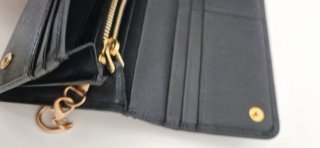 Pochette Prada nera con catena