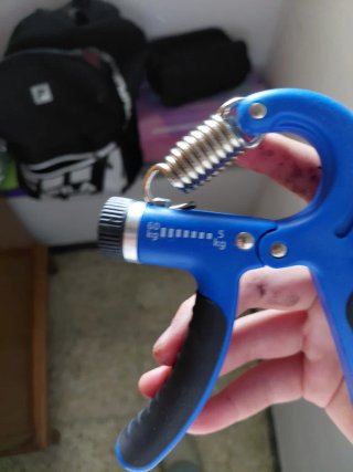 Entrenador de agarre azul