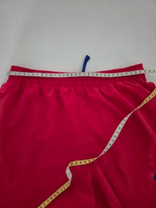 Costume da bagno ragazzo Nike rosso.