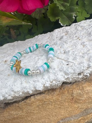 Pulsera perlas y estrella dorada