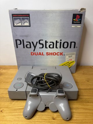PlayStation 1 con scatola inserti e manuali