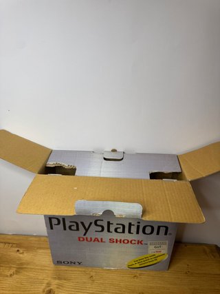PlayStation 1 con scatola inserti e manuali