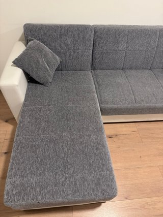 Sofá cama modular gris y blanco