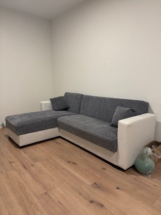 Sofá cama modular gris y blanco