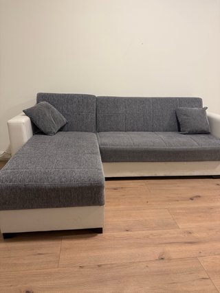 Sofá cama modular gris y blanco