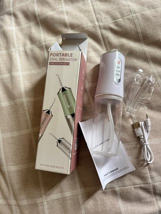 Irrigador Oral Portátil roto