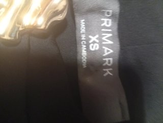 Blusa negra Primark con broche dorado Talla XS