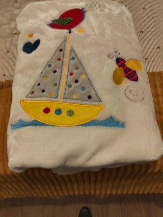 Manta de cuna con barco y pájaro