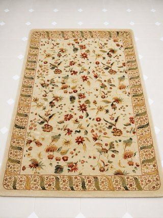 Alfombra beige y multicolor de tela y lana