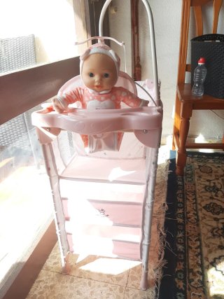 Carrito de bebé de juguete rosa
