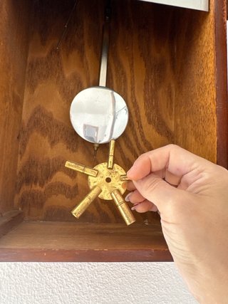 Reloj de péndulo Polaris antiguo