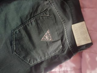 Jeans pinocchietto neri con rifiniture argentate
