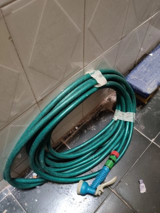 Manguera verde con boquilla