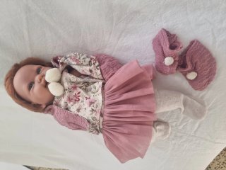 Muñeca Reborn con peluche y patita