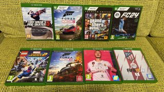 Xbox One X con 3 mandos y 8 juegos
