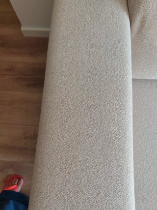 Sofá beige de tela en perfecto estado