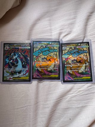 3 Cartas Pokémon: -Mega Charizard X  -dragonite