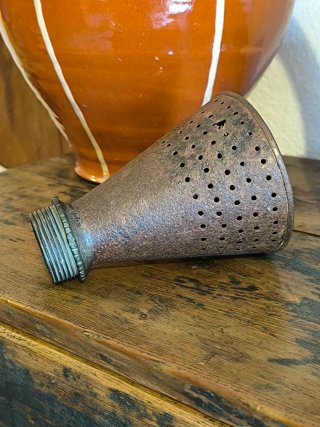 Antiguo espolveador