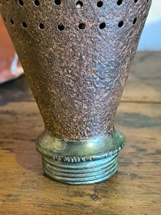 Antiguo espolveador