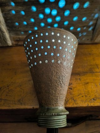 Antiguo espolveador