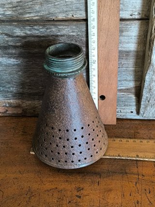 Antiguo espolveador